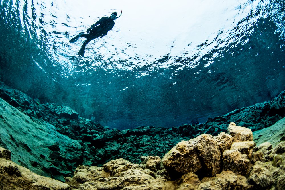 Snorkeler at the surface of Silfra